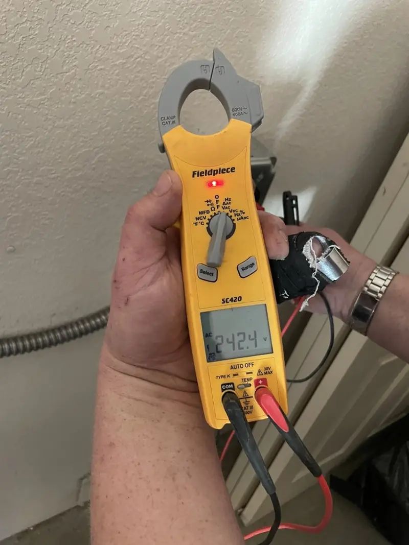 Voltage testing with clamp meter during Generator Installation in Lake Oswego